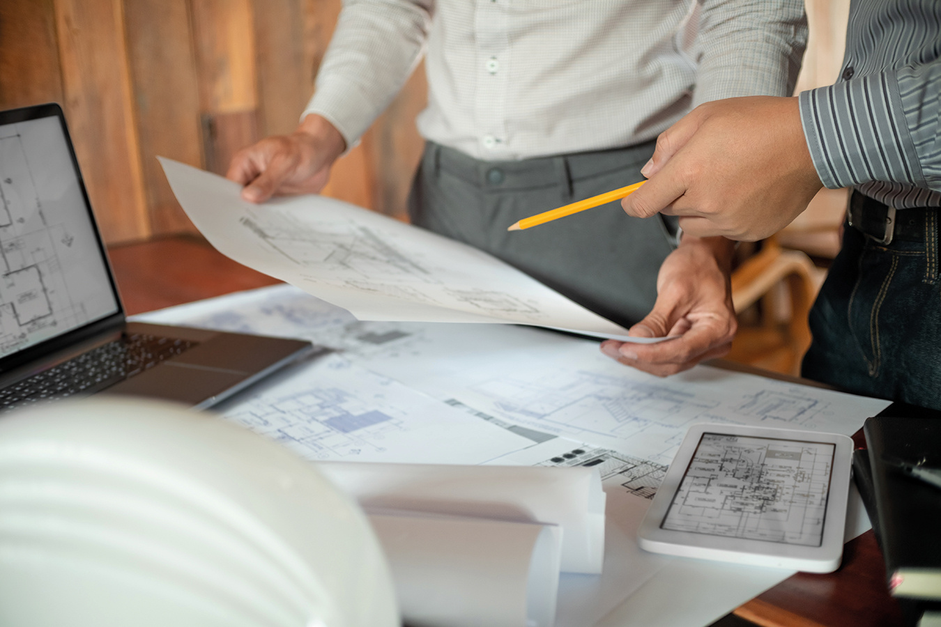 Architects interior designer hands working with Blue prints and documents for a home renovationÂ for house design